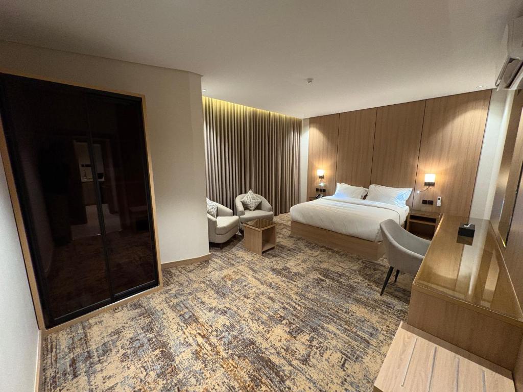 En eller flere senge i et værelse på فندق لايفان LYvAN HOTEL