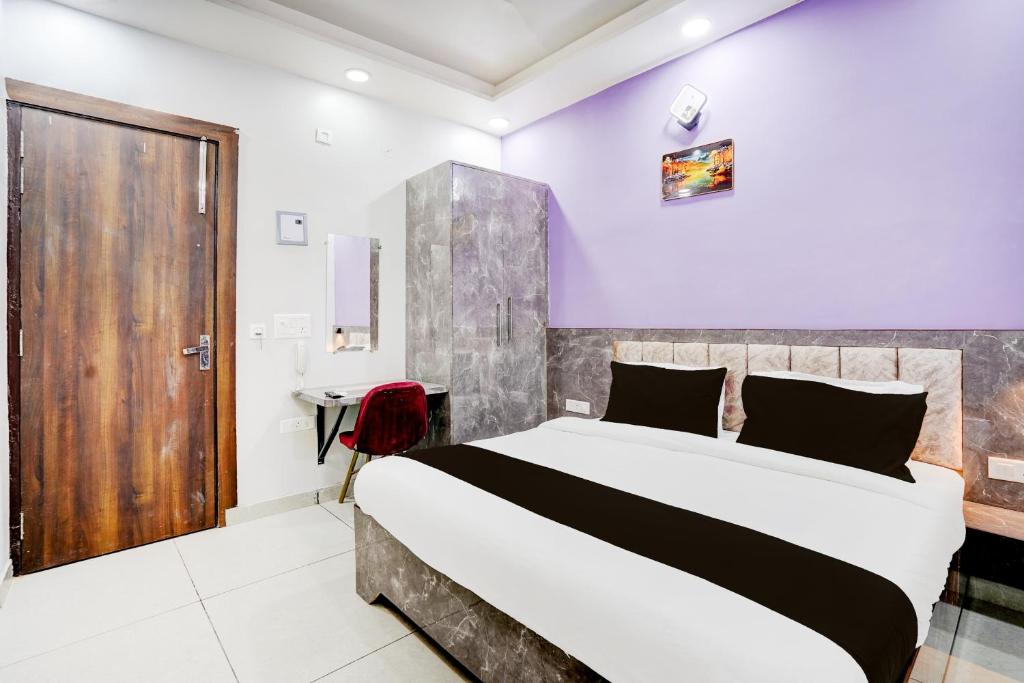 En eller flere senge i et værelse på Townhouse ROYAL ELAN