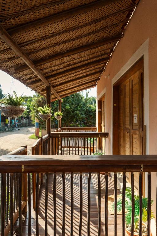 a wooden deck with awning on a house at Apartaestudio Privado con cocina in Palomino