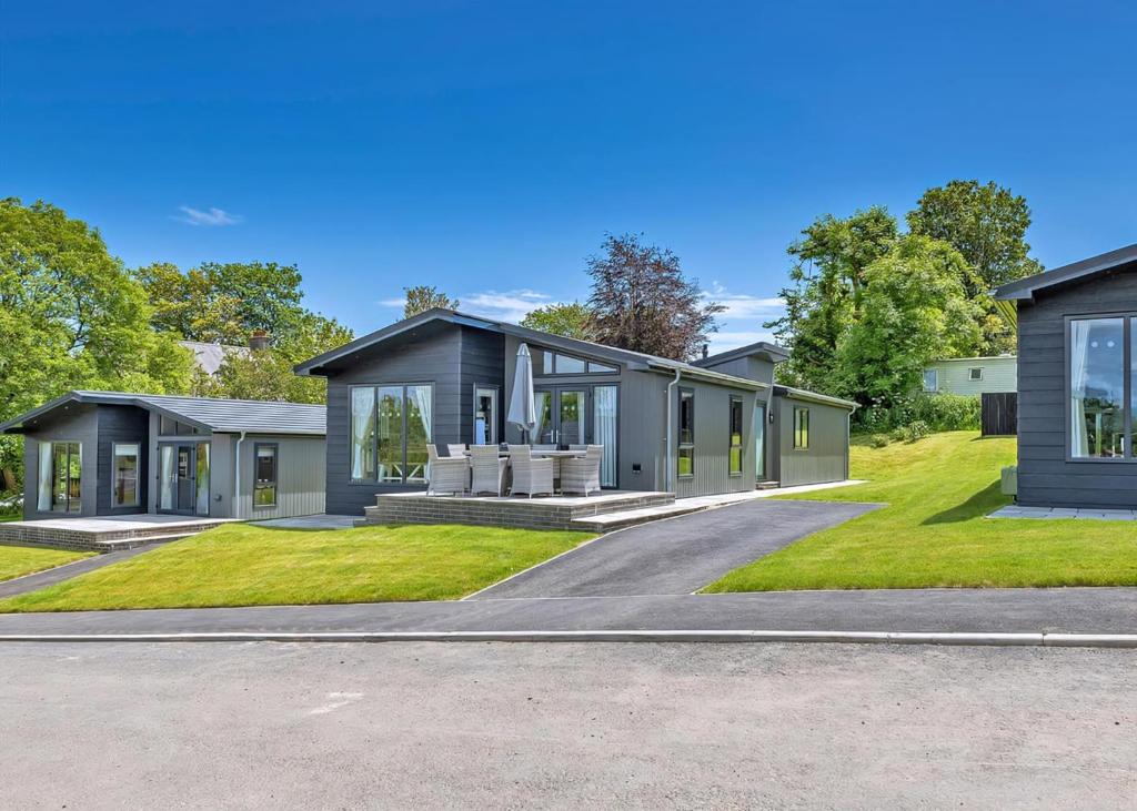 a rendering of a house with a driveway at Penally Grange in Tenby