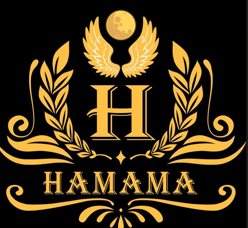 eine goldene Hamsa mit Lorbeerkranz und Aigil in der Unterkunft Grand Khalifa Hotel Hamama in Sylhet