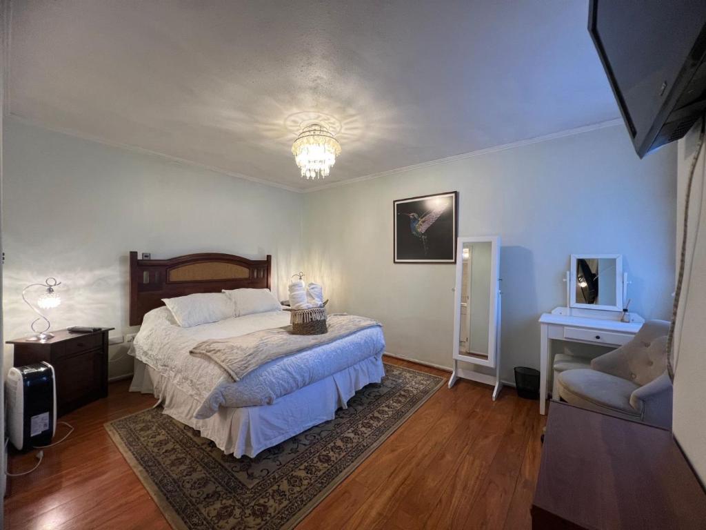 En eller flere senge i et værelse på Amplio Departamento en Centro de Concepción con estacionamiento 2D-2B