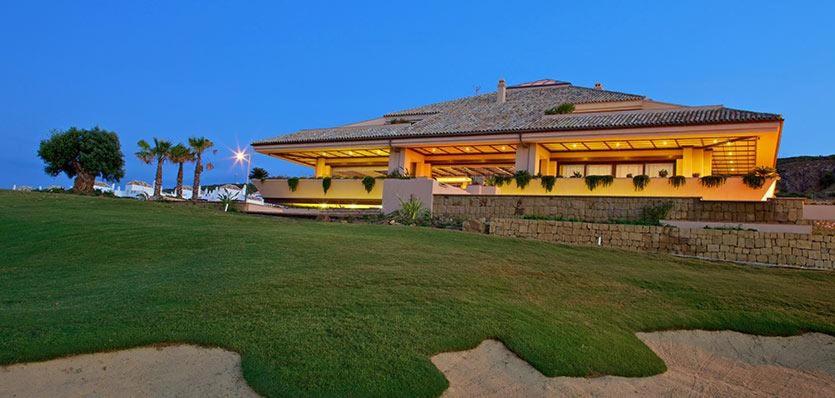 een groot huis met een gazon ervoor bij Valle Romano Golf Resort Estepona in Estepona