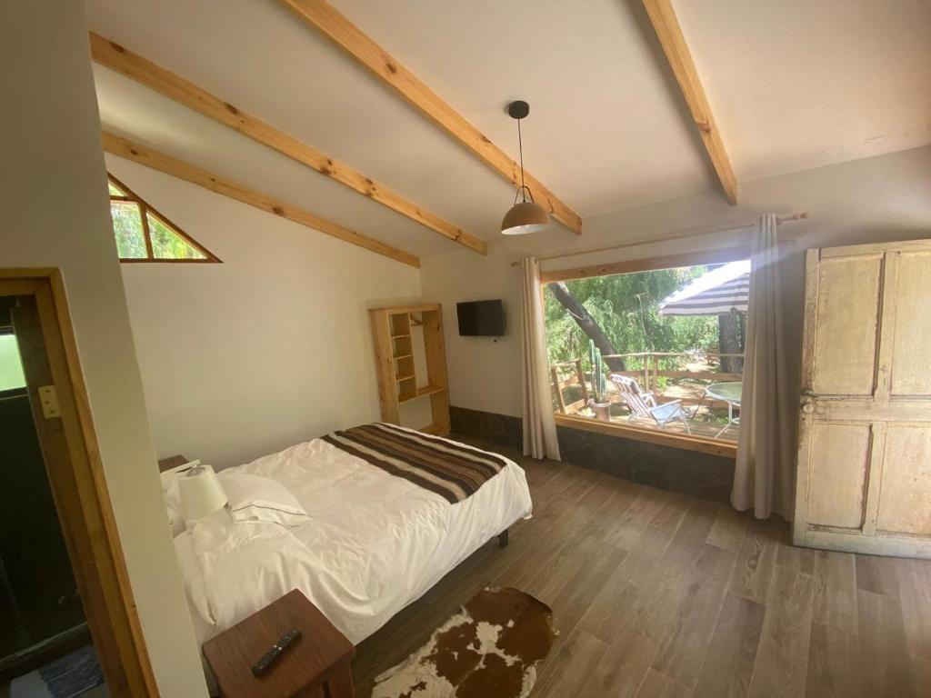 En eller flere senge i et værelse på Valle de Elqui Cabañas Elquisco