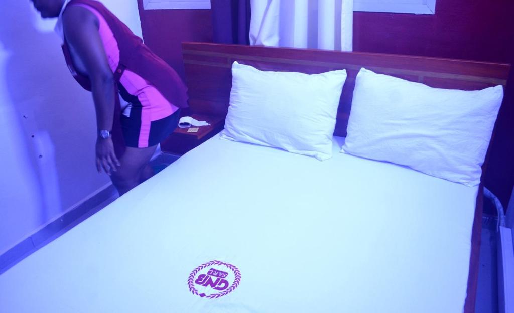 Katil atau katil-katil dalam bilik di Appartements meublés GNB