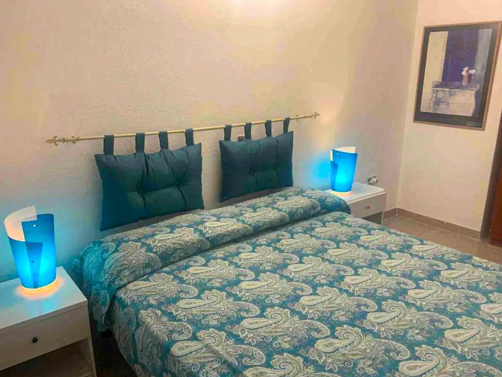 En eller flere senge i et værelse på Casa Elicriso