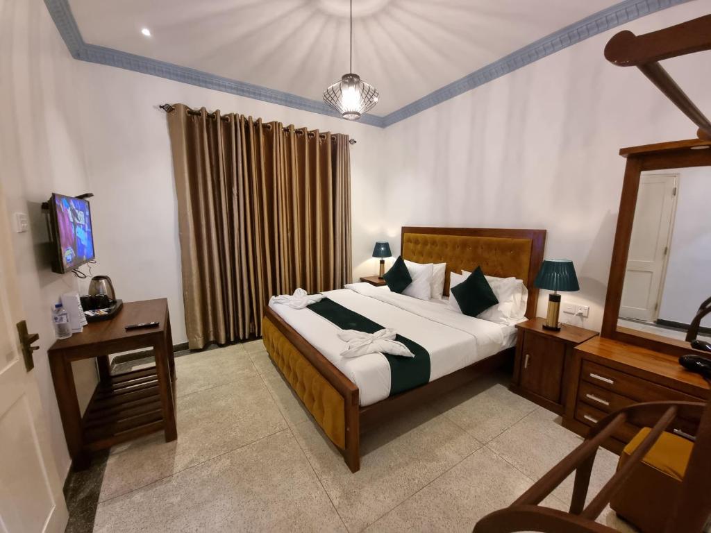 Postel nebo postele na pokoji v ubytování Astoria Cottage