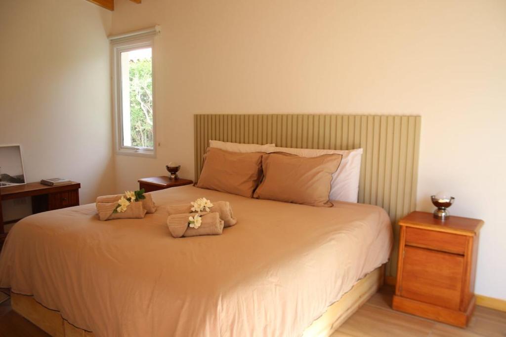 En eller flere senge i et værelse på Family Chalet Boutique