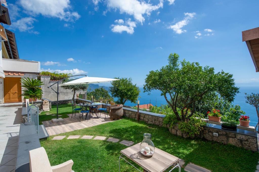 a garden with a view of the ocean at La Dimora del Bacchiss in Amalfi