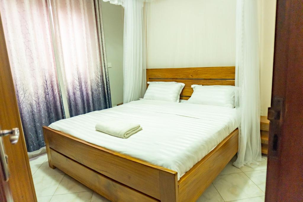 Postel nebo postele na pokoji v ubytování Global Apartments