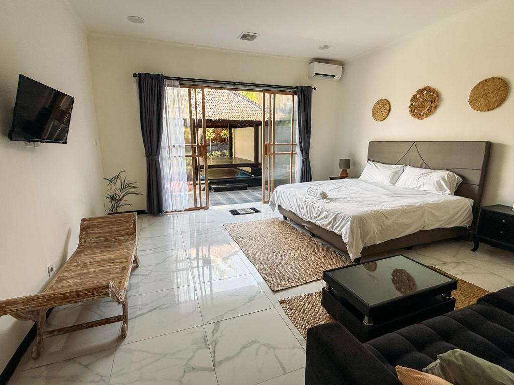 En eller flere senge i et værelse på Puri Sharai Homestay