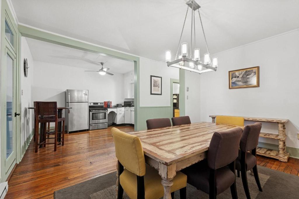 a dining room with a wooden table and chairs at The Loft in Whitefish