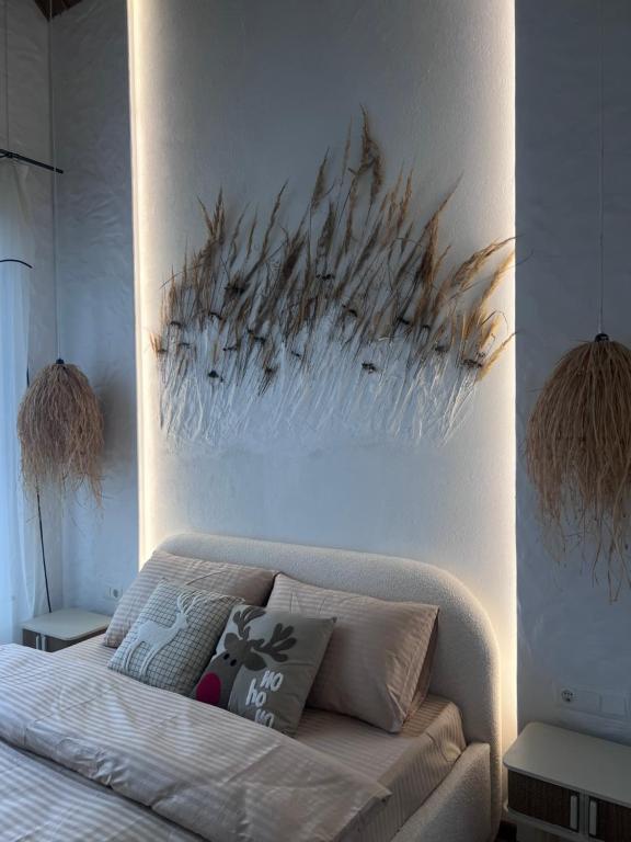 En eller flere senge i et værelse på Villa Pelahia