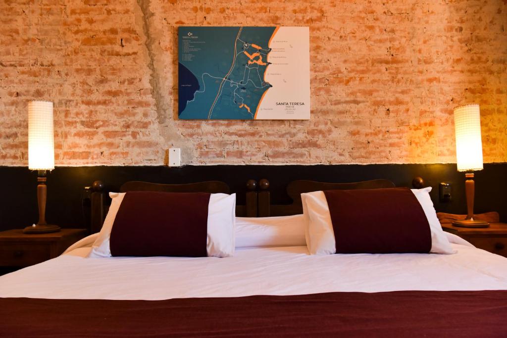 En eller flere senge i et værelse på Hosteria Del Pescador