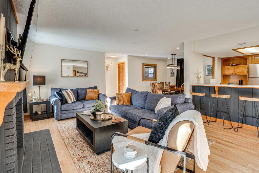 a living room with a couch and a table at Riverfront Lincoln Condo w/ Patio + Pool Access! in Lincoln