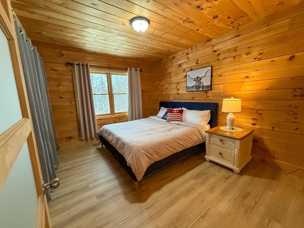 En eller flere senge i et værelse på Chalet La Source Rouge