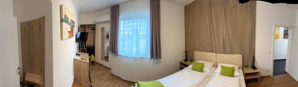 Postel nebo postele na pokoji v ubytování Hotel Garni Ilys Inn