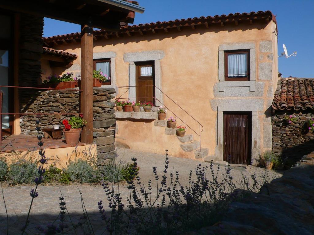 a house with a staircase leading up to it at Casa da Ti Cura in Atenor