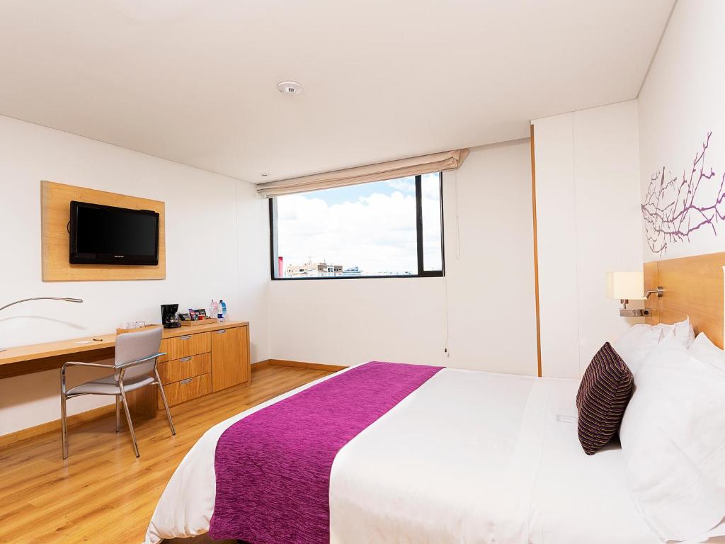 Postel nebo postele na pokoji v ubytování Hotel bh Parque 93