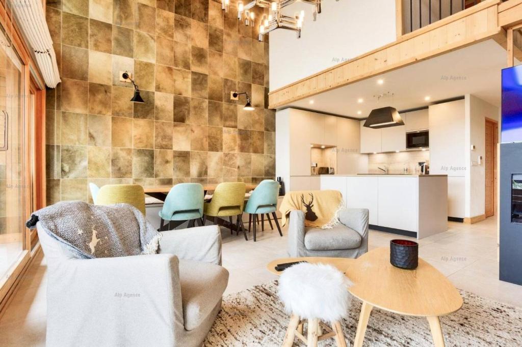 a living room with chairs and a table at Résidence Alpine Loft - 5 Pièces 10 pers- HAUT DE GAMME - ALPINE LOFT - 10ALPI - PLAGNE CENTRE MAE-2634 in Aime-La Plagne