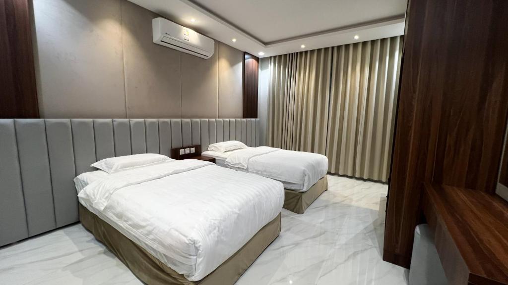 En eller flere senge i et værelse på متسع للشقق المخدومة