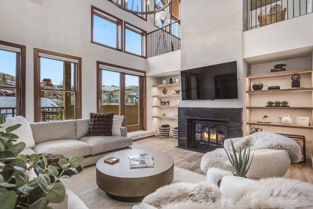 a living room with a couch and a fireplace at Woodrun Place 56 in Snowmass