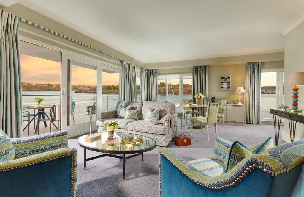 a living room with a couch and chairs and a table at Trident Hotel Kinsale in Kinsale