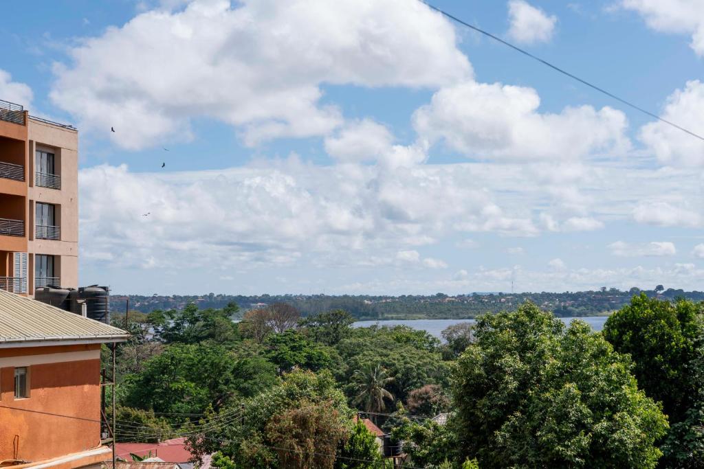 a view of a lake from a building at One minute to Victoria Mall & 8 minutes to Entebbe airport in Entebbe