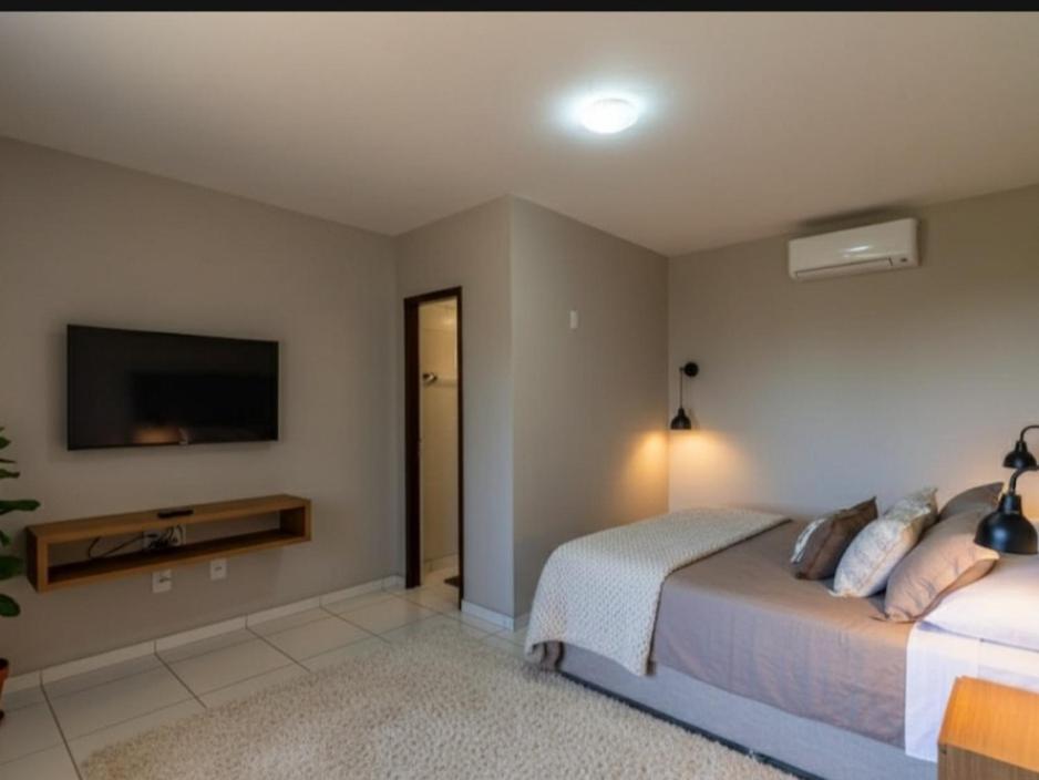 En eller flere senge i et værelse på Pousada Cruzeiro dos Anjos