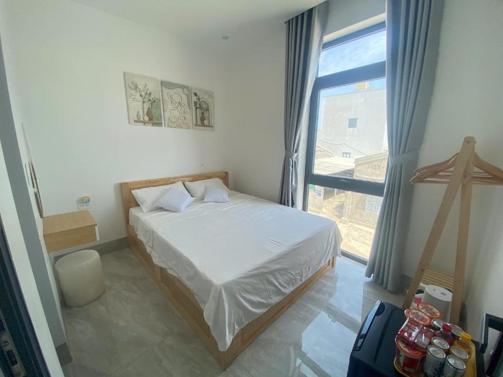 Postel nebo postele na pokoji v ubytování Aloha Homestay - Đảo Phú Quý