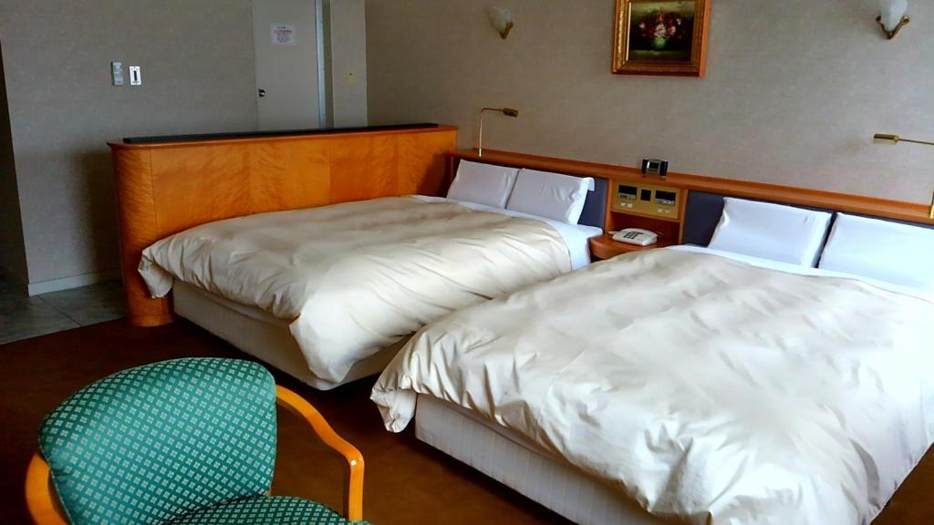 Postel nebo postele na pokoji v ubytování Hotel Hitachi Hills