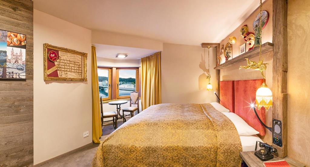 Postel nebo postele na pokoji v ubytování Boutique Hotel im Auracher Löchl