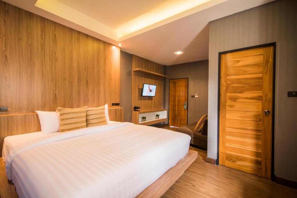 Postel nebo postele na pokoji v ubytování Le Terrarium Bed & Sleep Chiang Rai