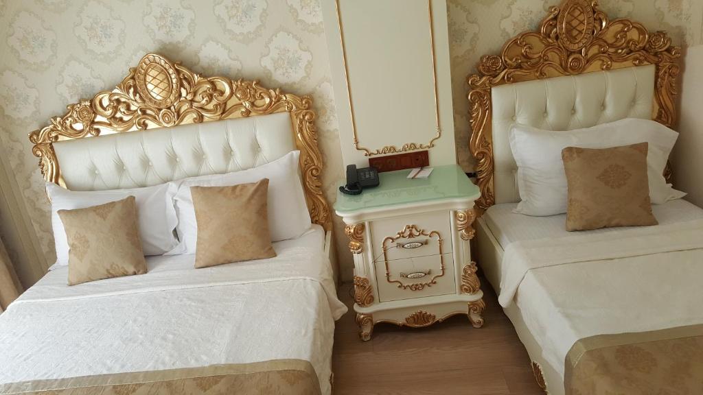 Postel nebo postele na pokoji v ubytování Best Town Hotel