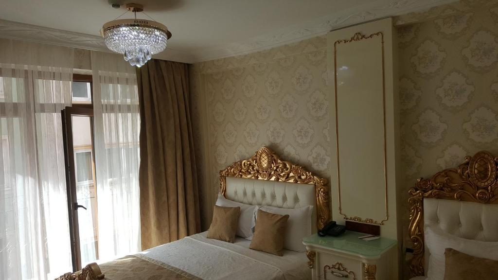 Postel nebo postele na pokoji v ubytování Best Town Hotel