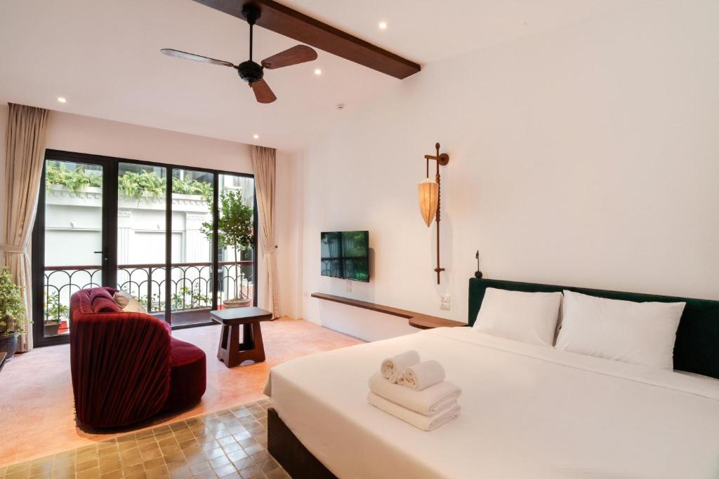 Ένα ή περισσότερα κρεβάτια σε δωμάτιο στο Maison Nhã 28 Mạc Đĩnh Chi