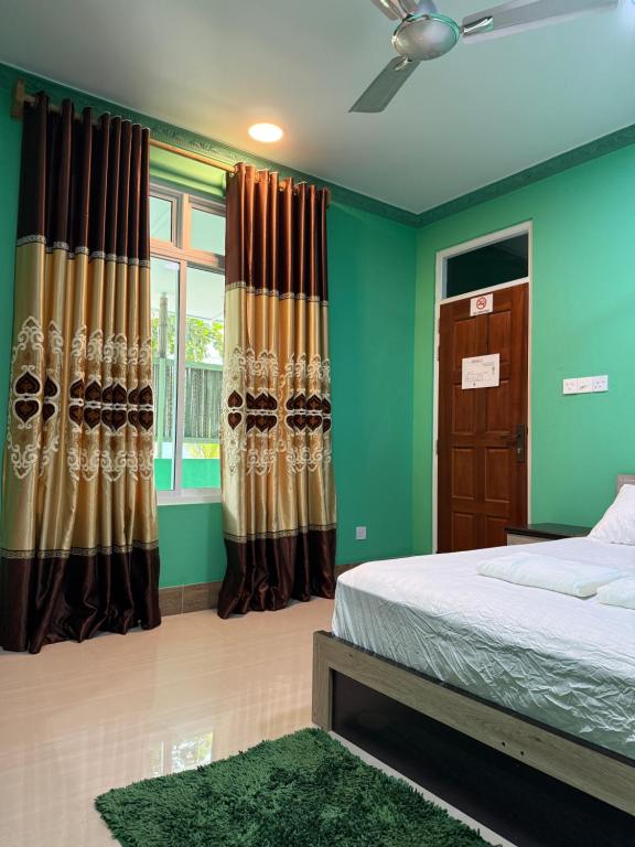 Ένα ή περισσότερα κρεβάτια σε δωμάτιο στο Coconut Palm Dhidhoo