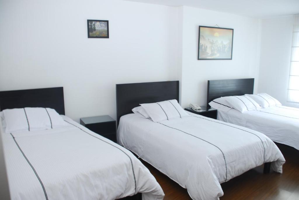 Postel nebo postele na pokoji v ubytování Hotel Real Estación