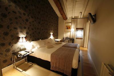 Postel nebo postele na pokoji v ubytování Hotel Palacio Muñatones