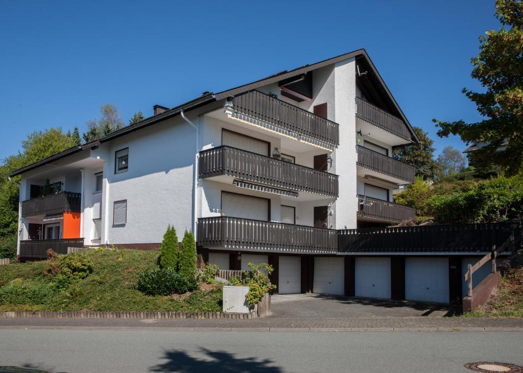 an apartment building with balconies on the side of it at Apartment Am Kleehagen 26, Winterberg-Niedersfeld in Winterberg