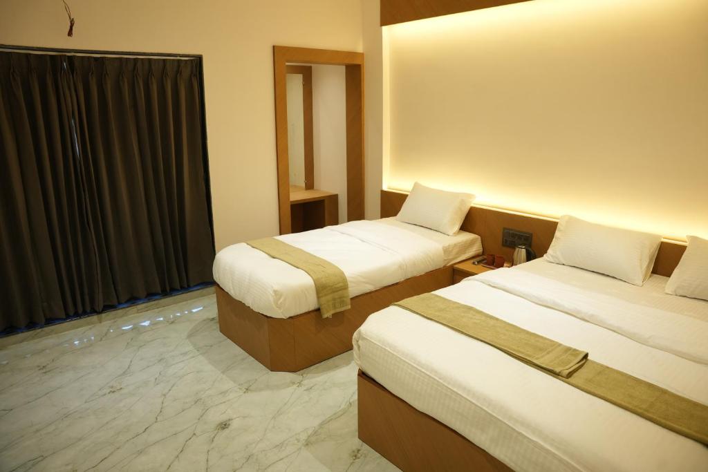 En eller flere senge i et værelse på Hotel Nature's Nest