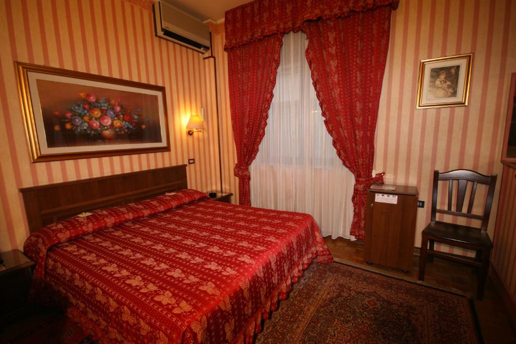 Postel nebo postele na pokoji v ubytování Hotel Italia City Center