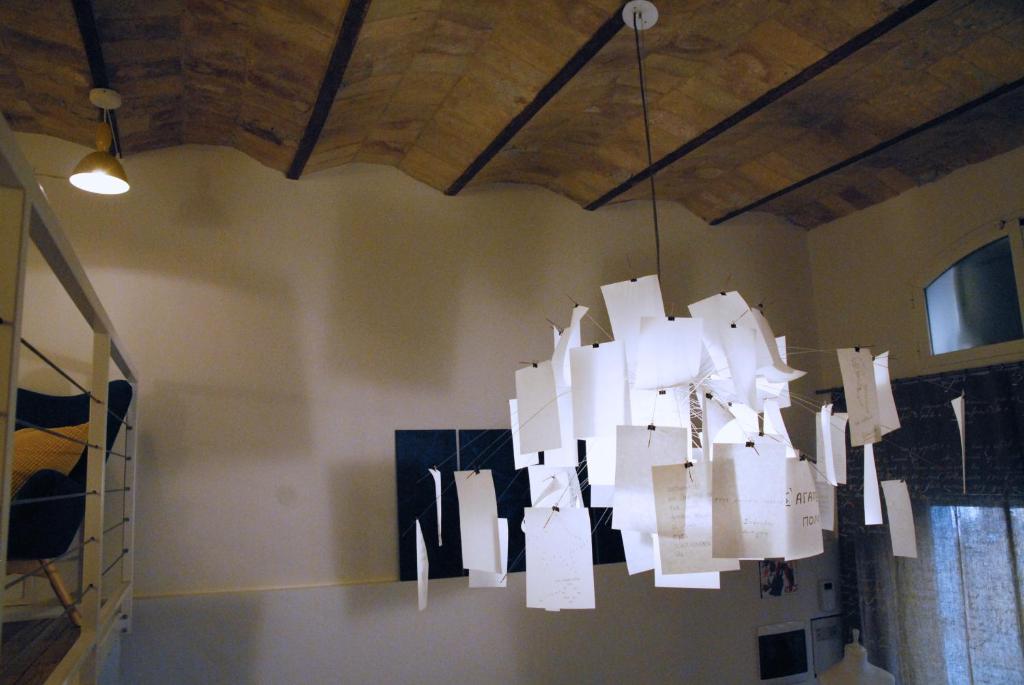 a chandelier hanging from the ceiling in a room at Loft 17 in Albano Laziale