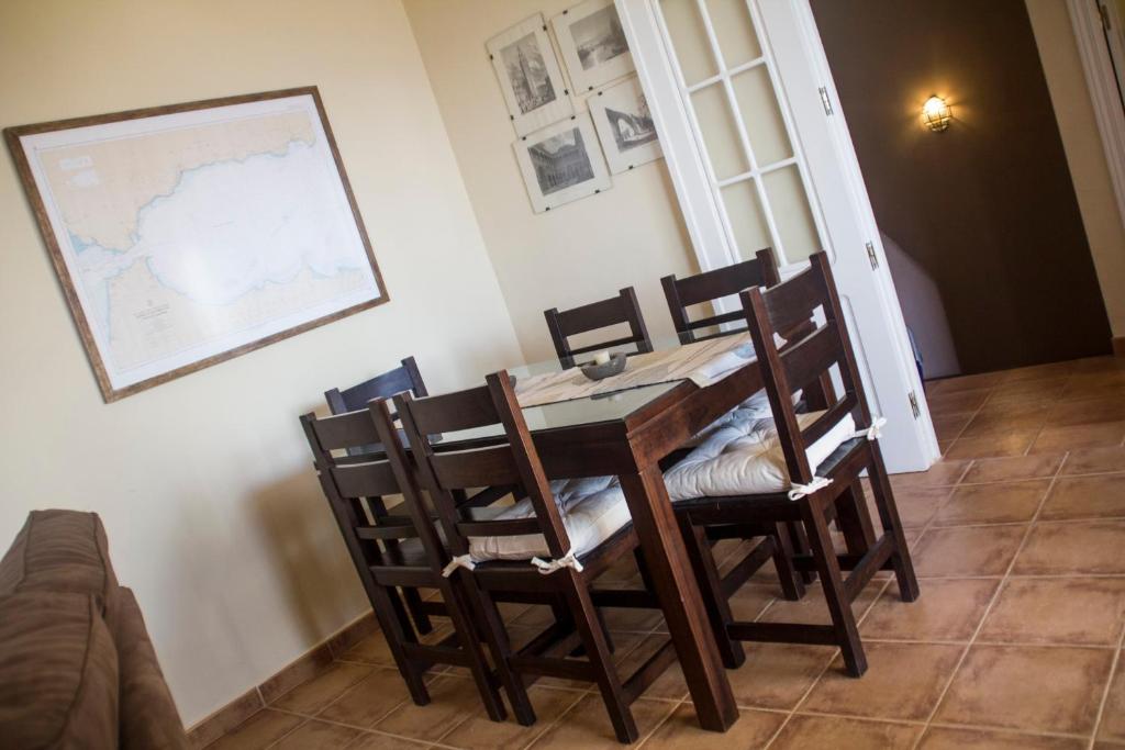 a dining room with a table and chairs at Casa José in La Herradura