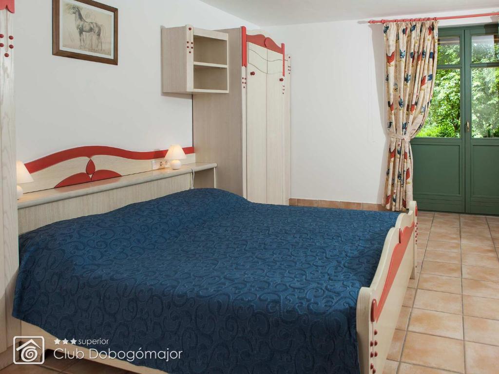 Postel nebo postele na pokoji v ubytování Club Dobogómajor superior