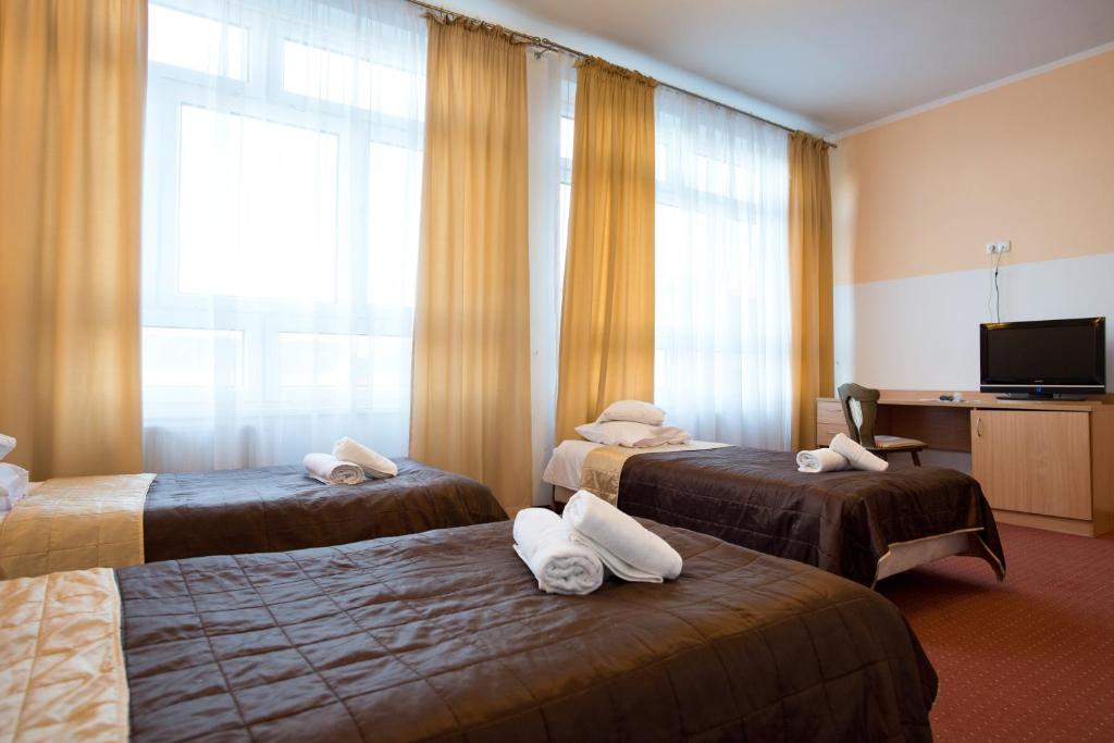 Postel nebo postele na pokoji v ubytování Zajazd Polonez
