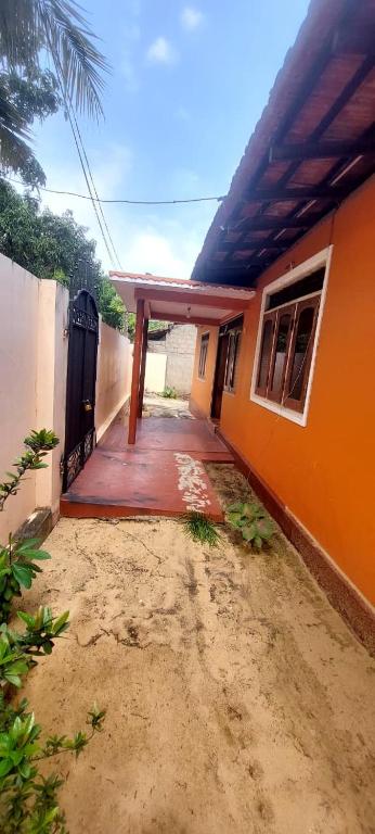 an outside view of a house with a porch at MD Retreat in Kalpitiya