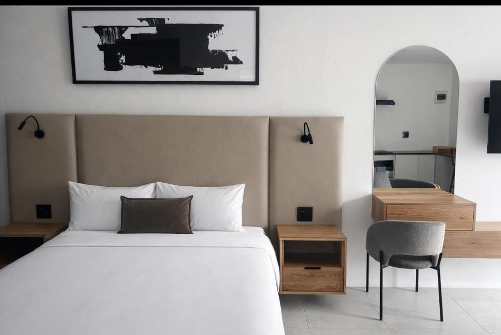 En eller flere senge i et værelse på The Spear Guest Lodge