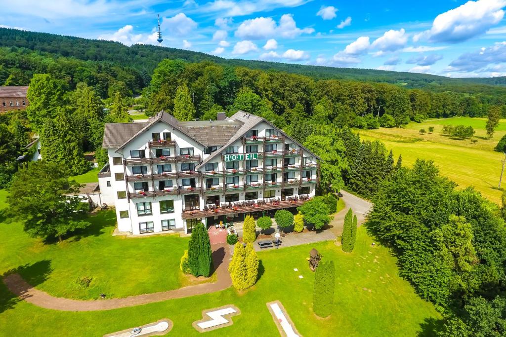 an aerial view of a hotel on a green lawn at Wohlfühlhotel DER JÄGERHOF in Willebadessen