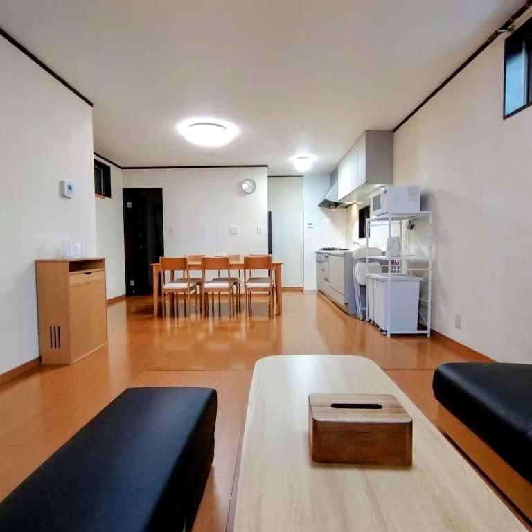 a living room with a couch and a table at 京旅别莊 in Kyoto